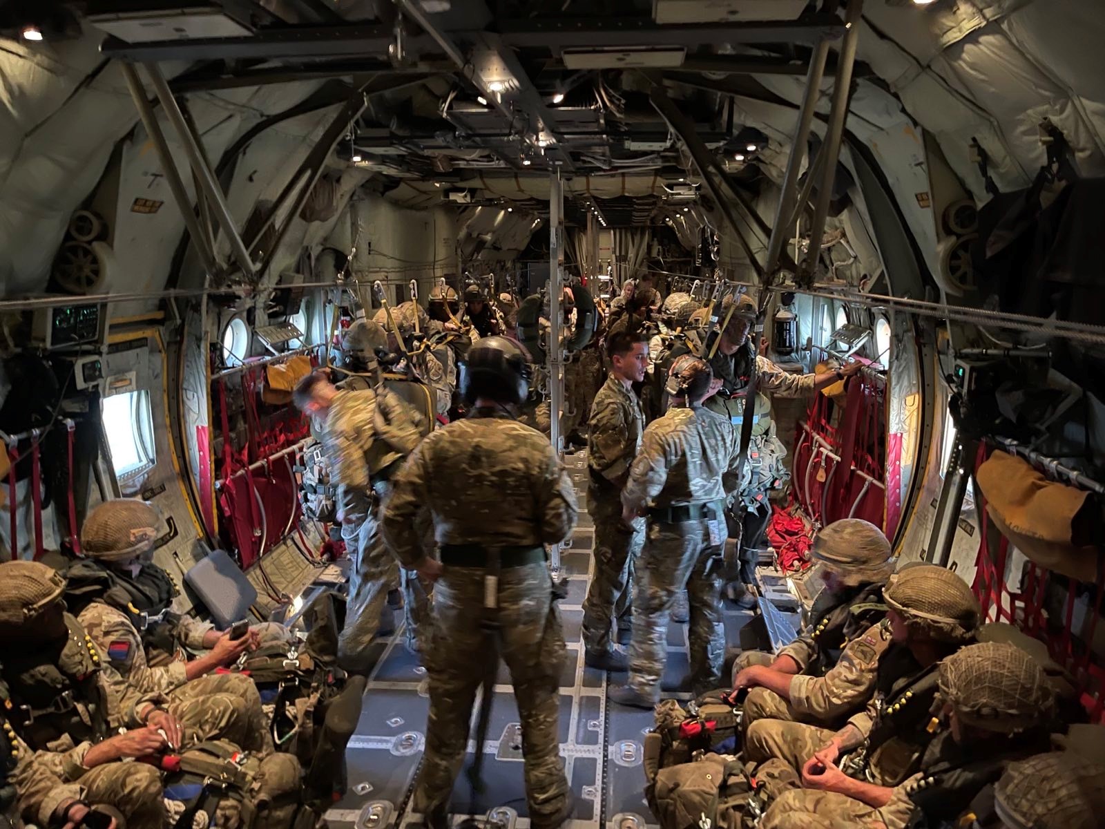 Personnel inside Hercules aircraft.
